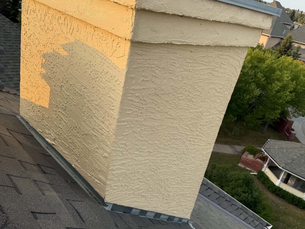 Close detail of stucco work on a chimney exterior