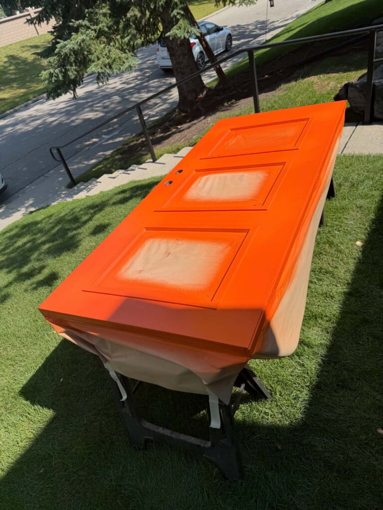 Exterior door colour application in progress