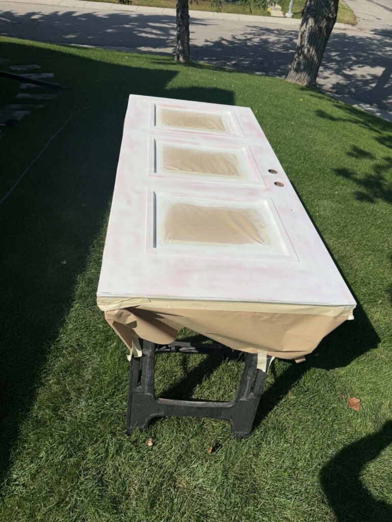 Exterior door prepared and primed for finishing